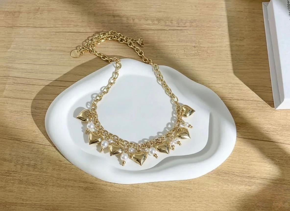 Collana sonaglio con cuori e perle in acciaio inox 316l