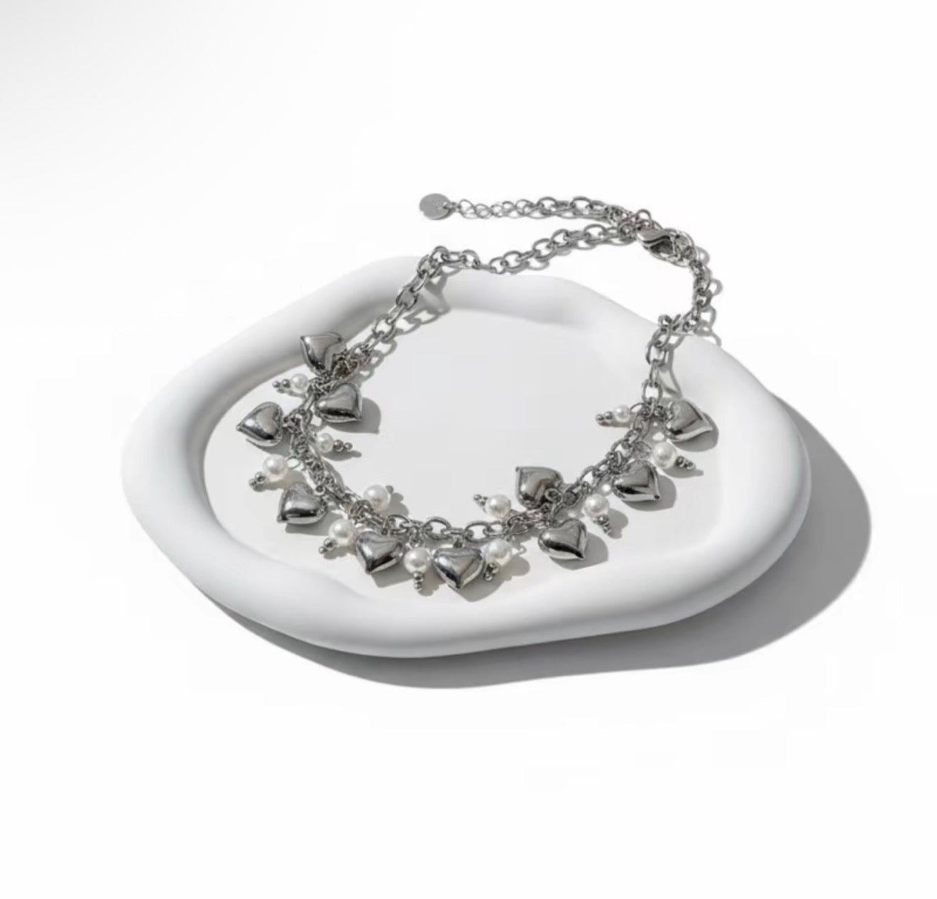 Collana sonaglio con cuori e perle in acciaio inox 316l
